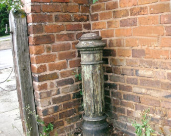 Photo shows the original sewer stack outside the boundary wall of 8 Raven Street. On the left is the gate post for the gate which closed off the street when it was a cul de sac.