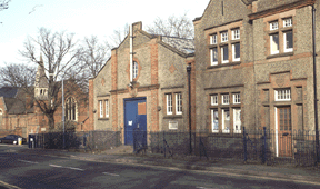 The Drill Hall 2002, to left with circular window & flag pole, pre-demolition